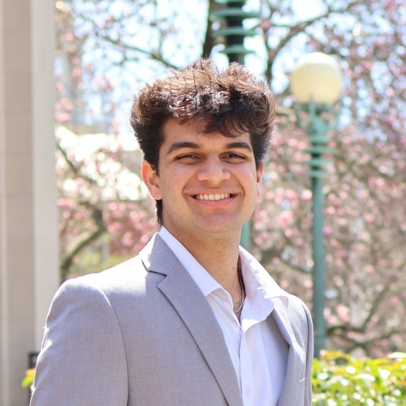 Eshan Ali, founder of Brightpeer, smiling on Brown University's campus